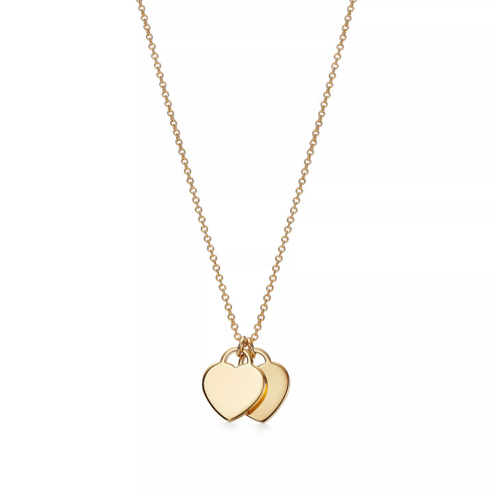 Collier TF en or avec pendentif cœur bleu