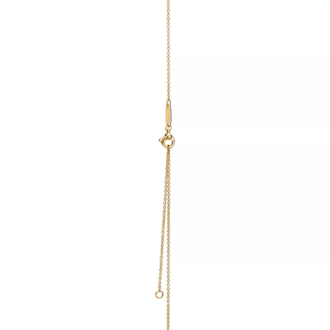 Collier TF en or avec pendentif cœur bleu