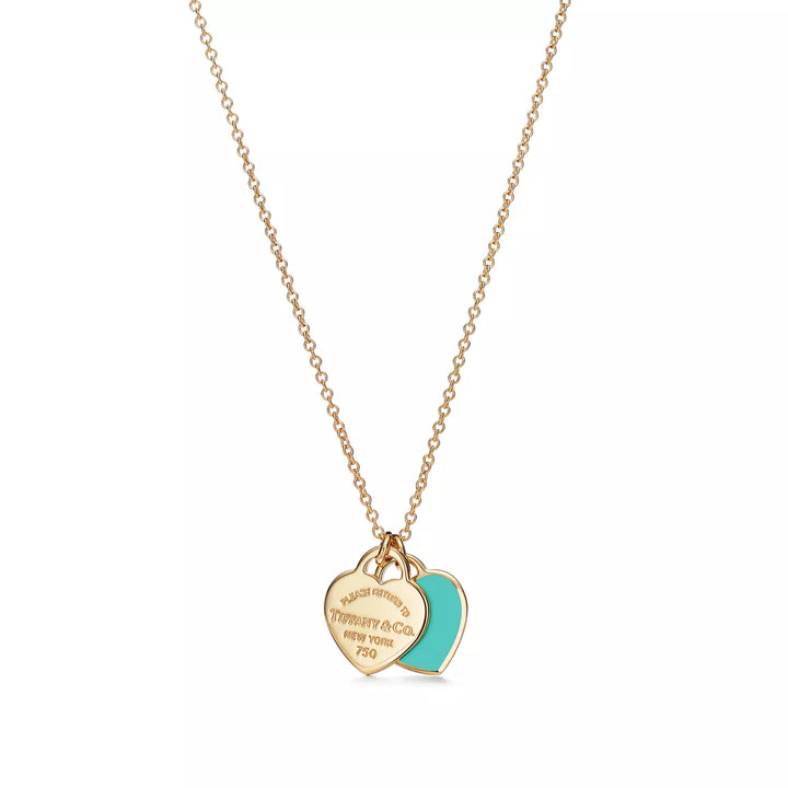 Collier TF en or avec pendentif cœur bleu