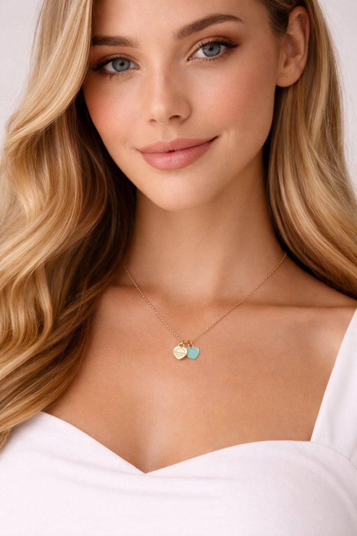 Collier TF en or avec pendentif cœur bleu